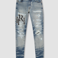 Amiri Staggered Logo Jeans Vintage Indigo