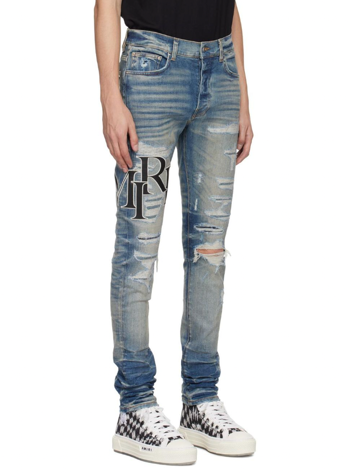 Amiri Staggered Logo Jeans Vintage Indigo