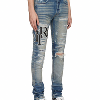 Amiri Staggered Logo Jeans Vintage Indigo
